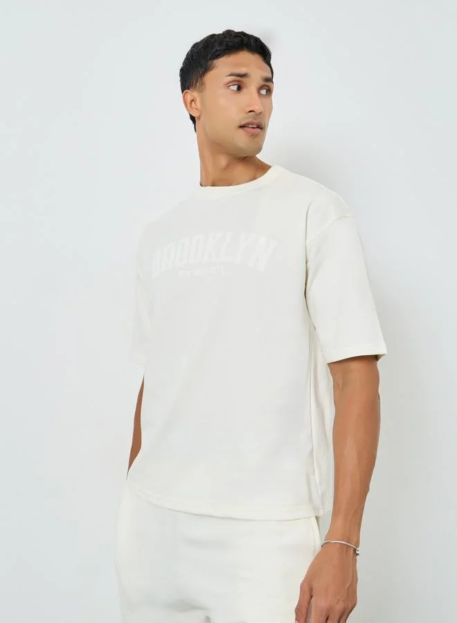 Styli Men Cream Oversized T-Shirt and Drawstring Pants Co-Ords
